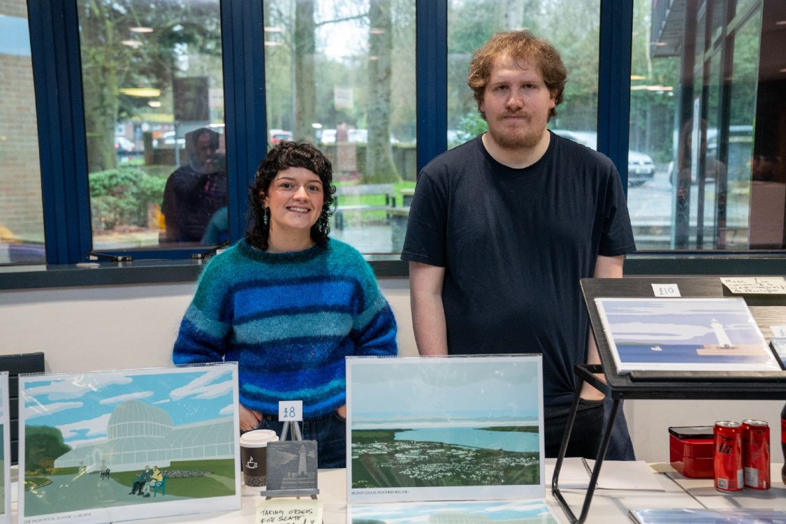 Students selling artwork at Bangor Spring Market